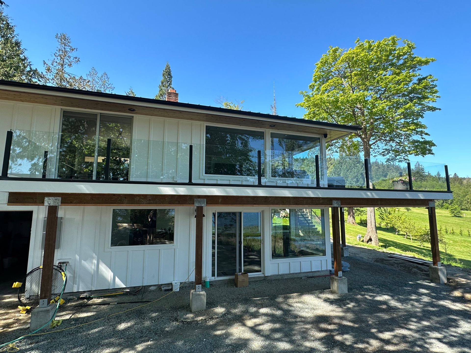 Installed glass railing with black posts