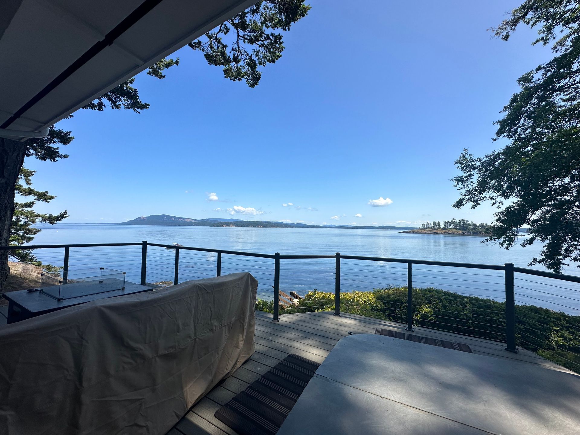 New deck and gray cable railing systems