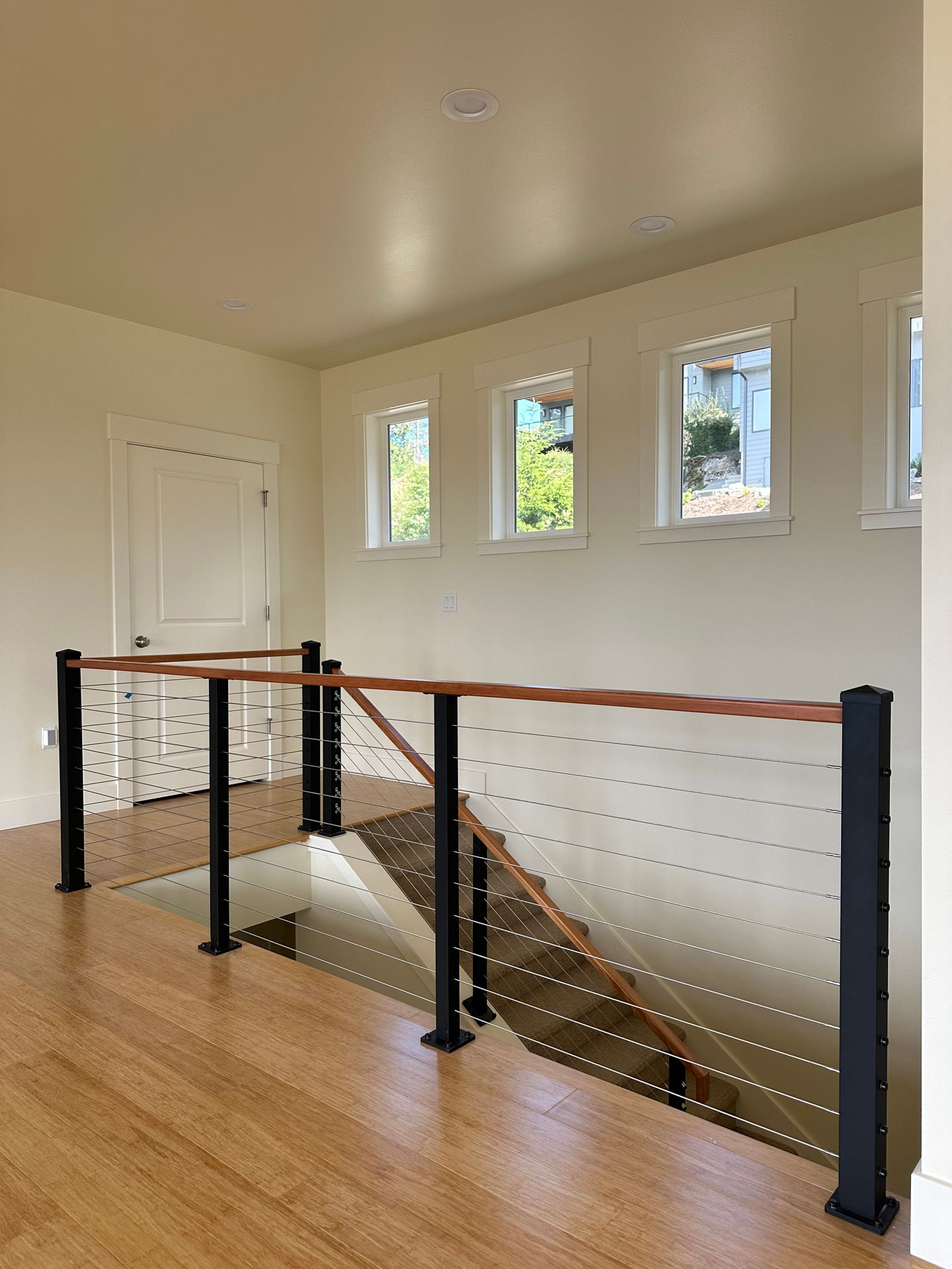 Brand new wood stair with cable railing