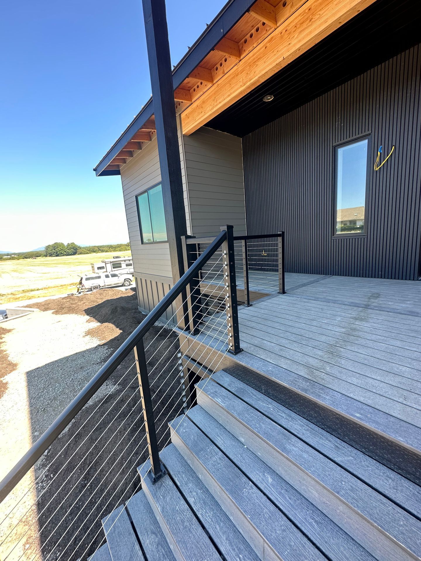 Gray steps with cable railings