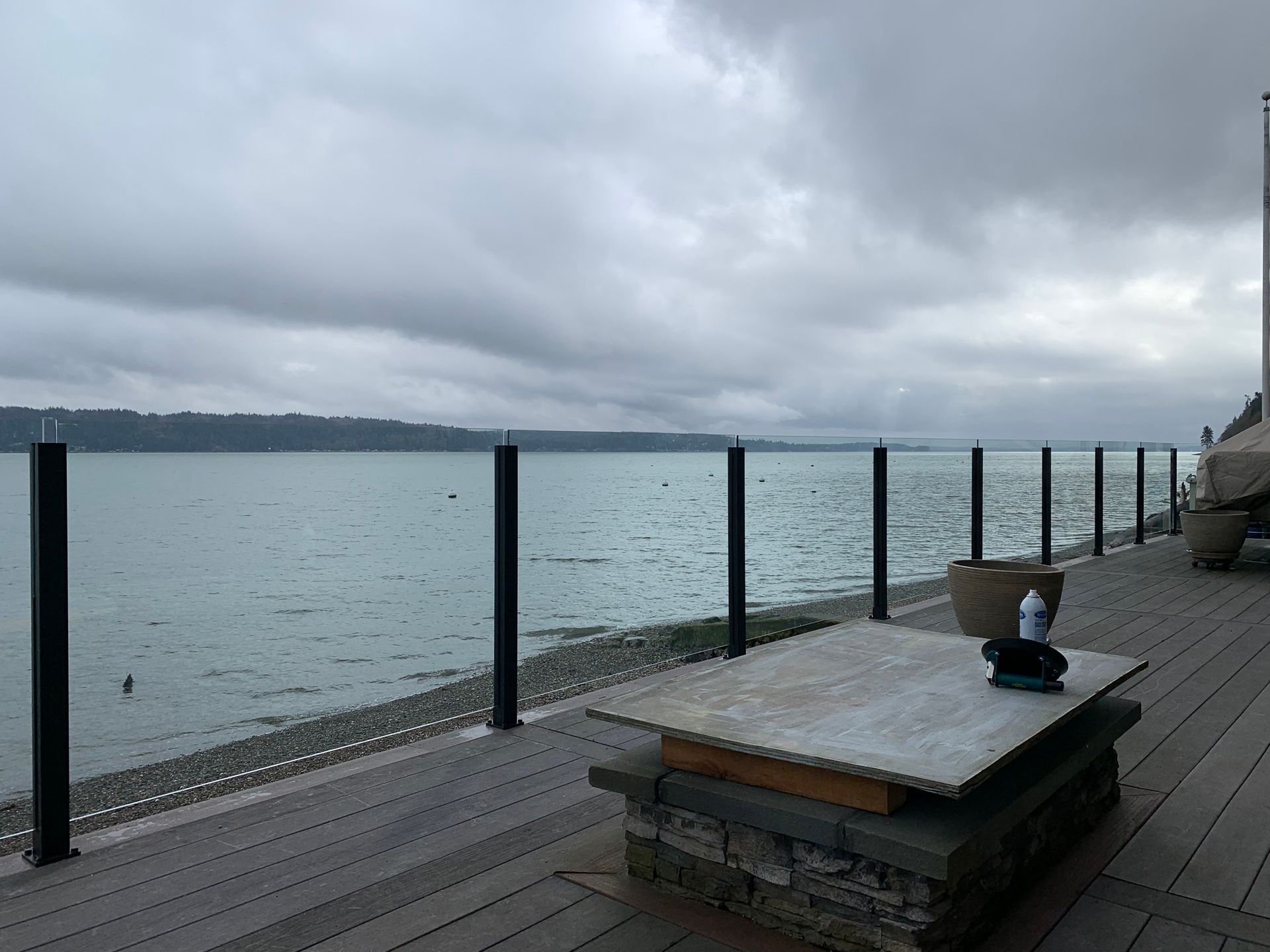 Custom-made black foundation glass railing system