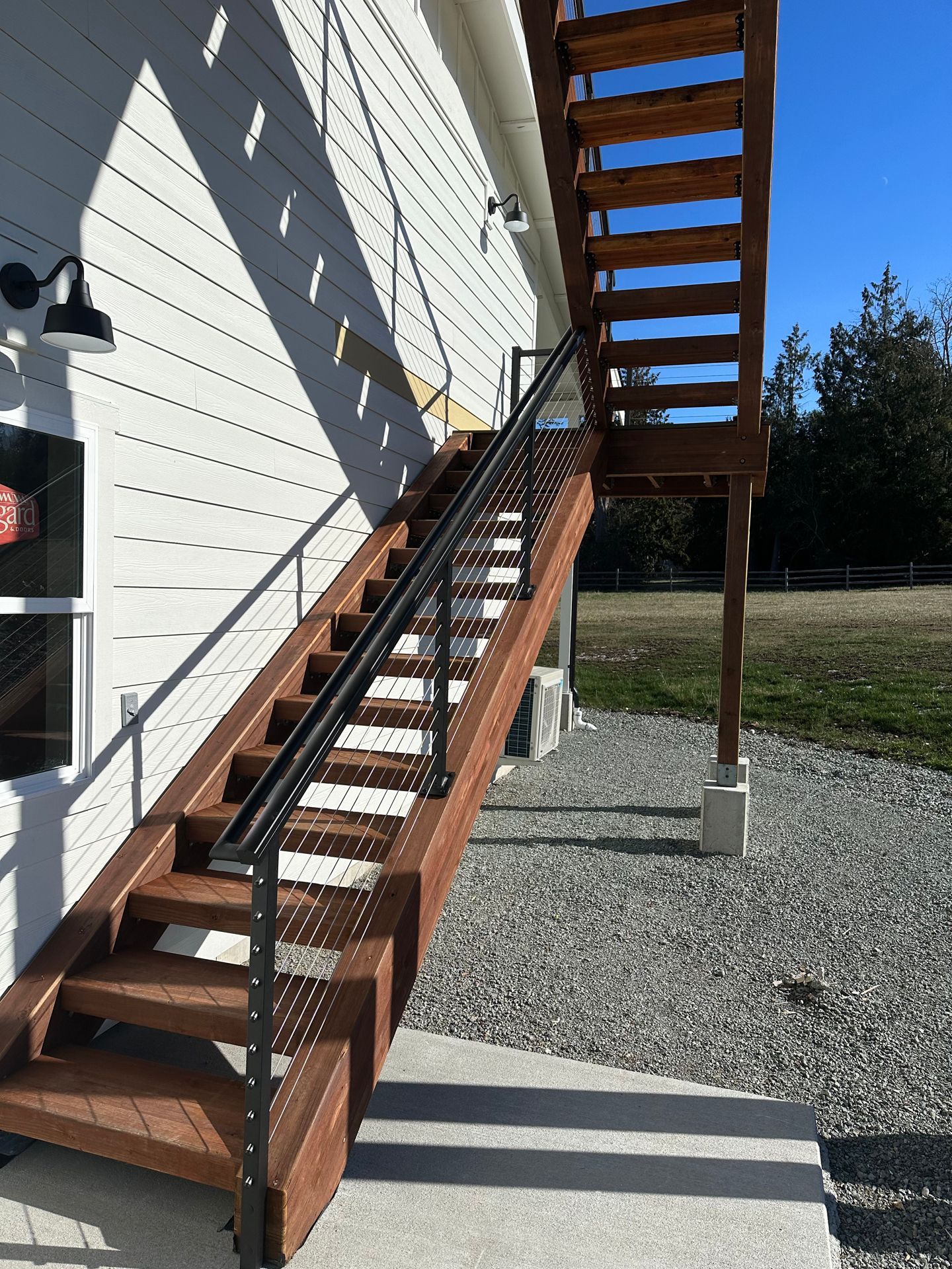 Newly installed brown stairs & railing