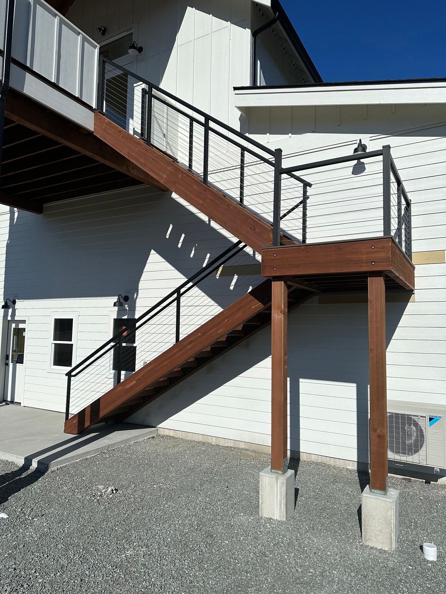 Newly installed brown stairs & railings