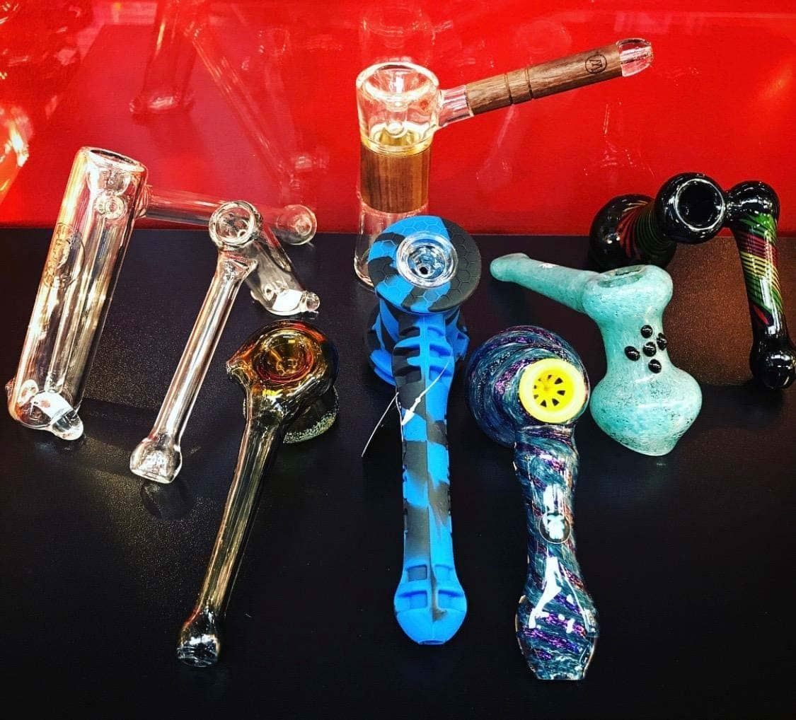 A bunch of pipes are lined up on a table