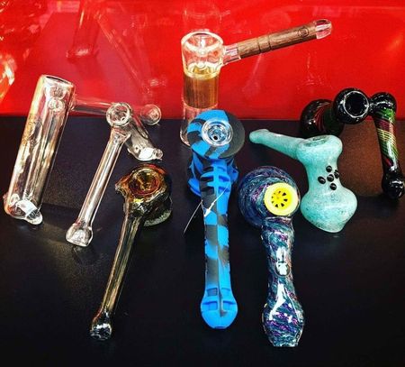 A bunch of pipes are lined up on a table