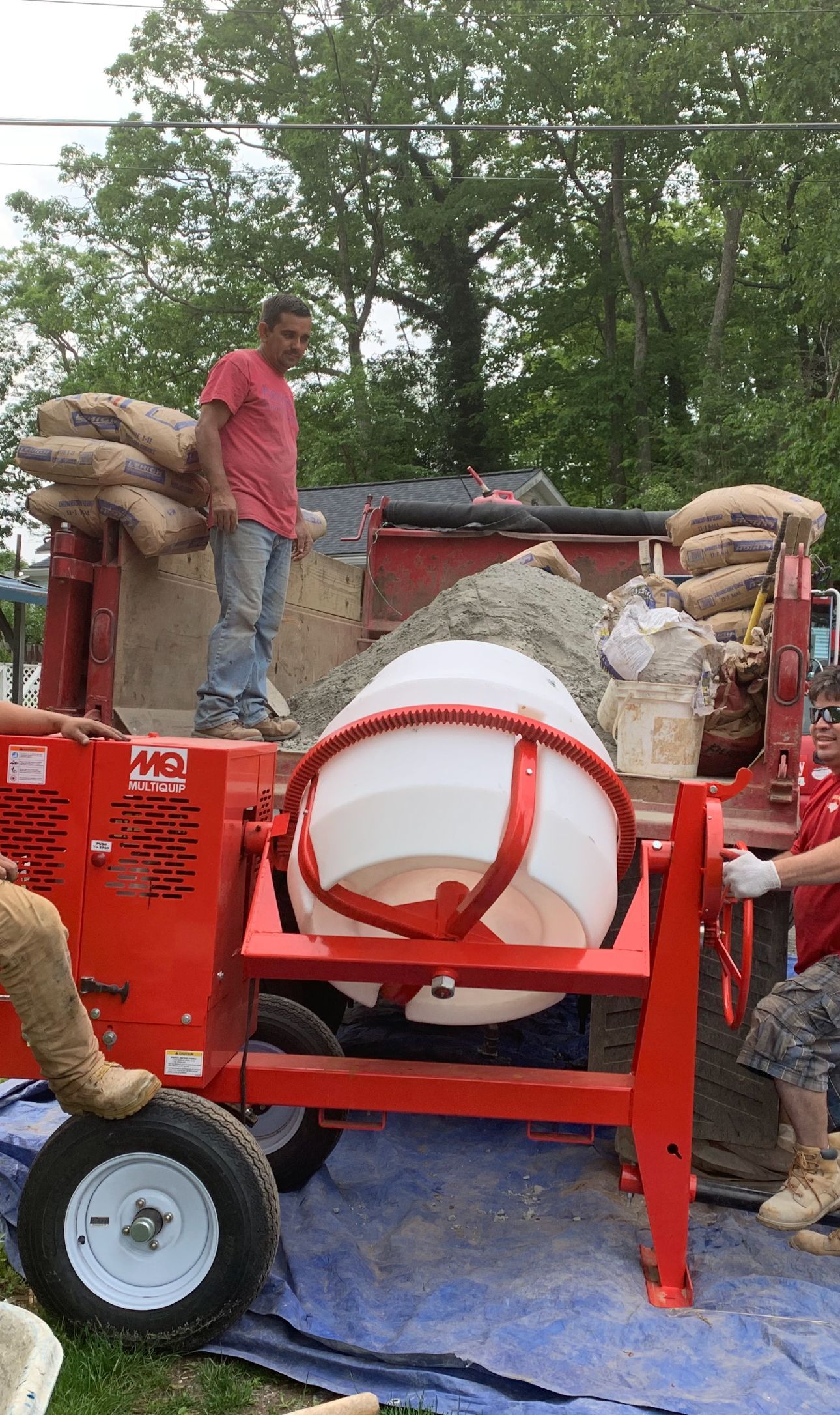 Man working with a cement mixer