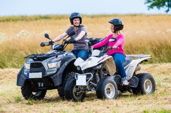 Couple riding an ATV