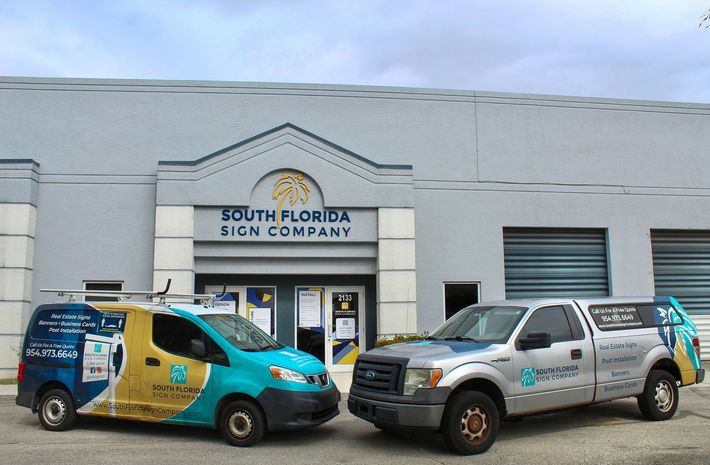 A building with a sign that says south florida sign company