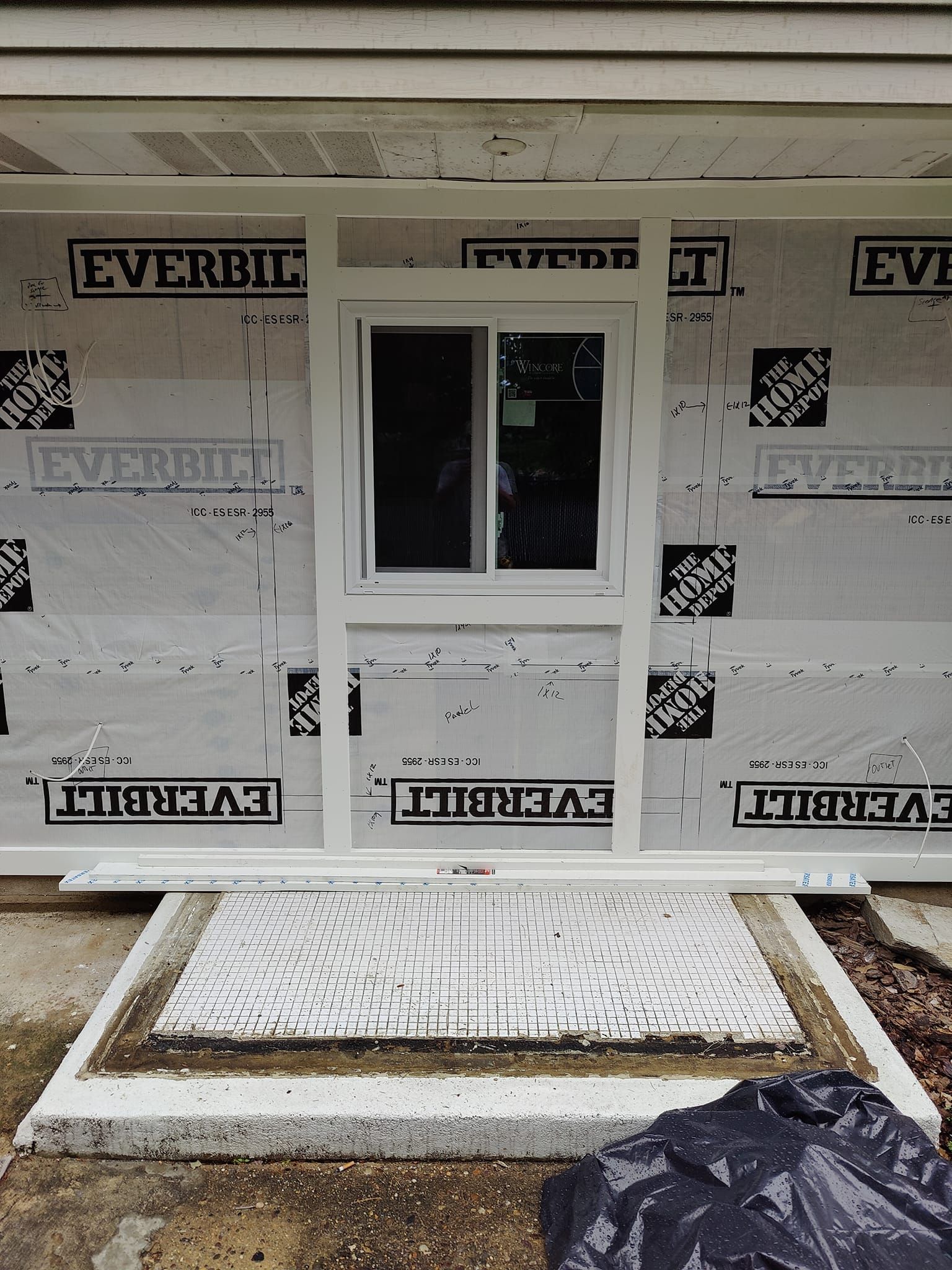 A house is being built with a door and window