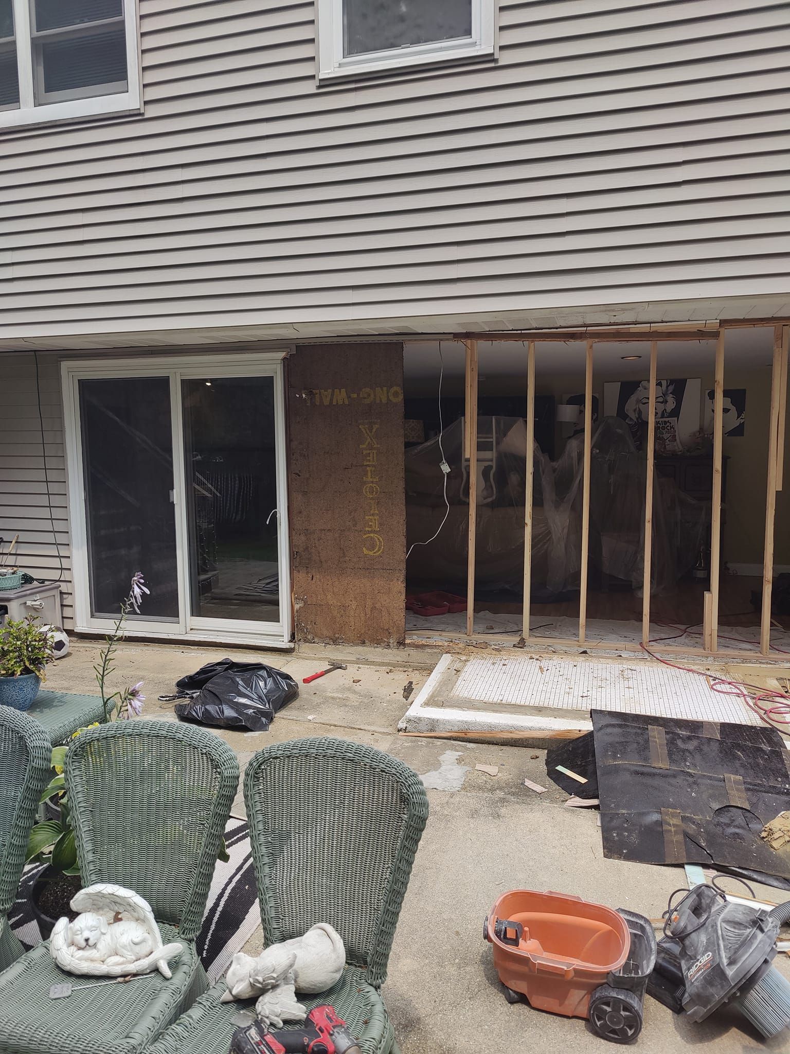 A house is being remodeled with a sliding glass door.