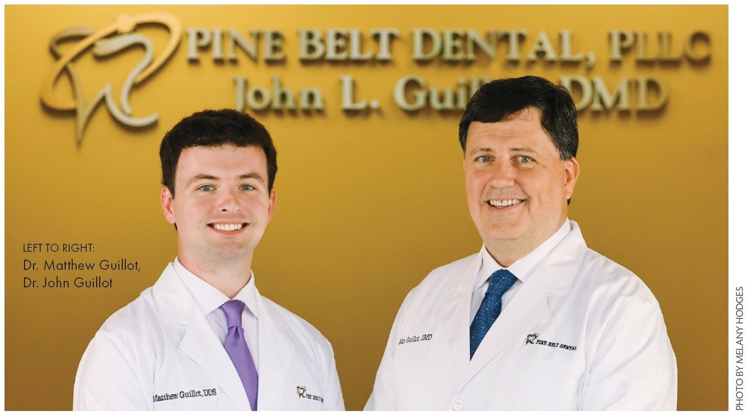 Two dentists, John L. Guill, DMD, and Dr. Andrew Guill, smile in lab coats; Pine Belt Dental logo is above them.