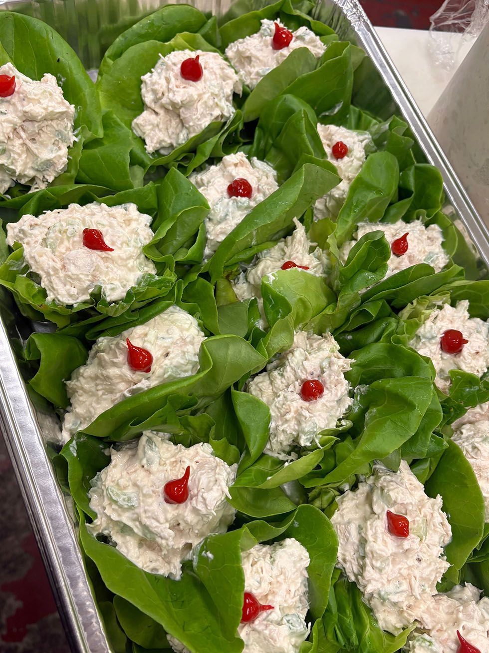 Lettuce cups with fillings, arranged on a tray