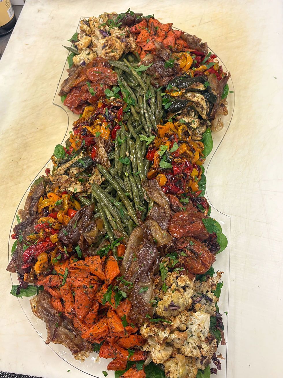 Assorted grilled vegetables and meat arranged properly