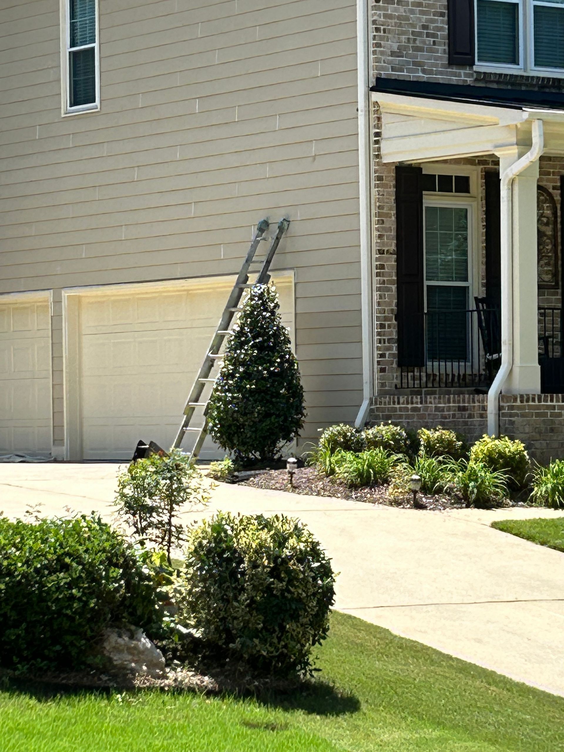 A ladder is leaning against the side of a house