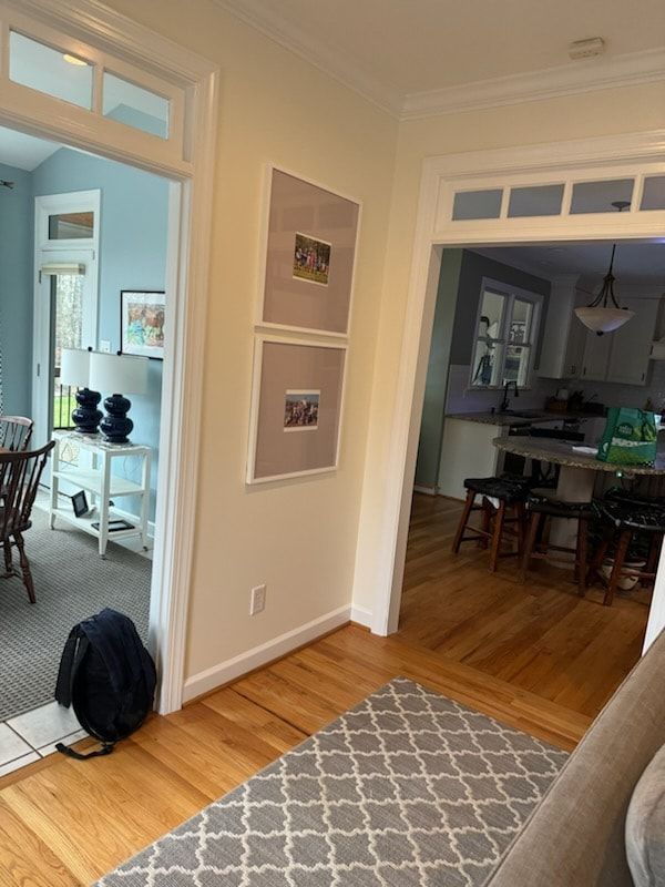 A living room with hardwood floors and a rug