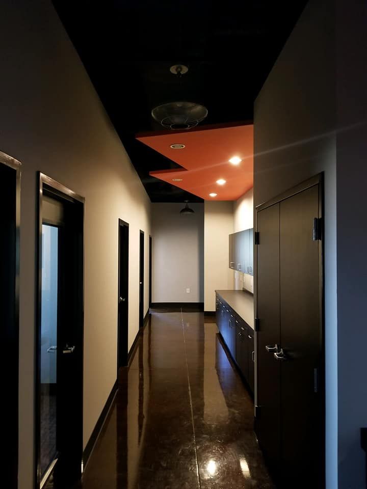 A long hallway with a triangle shaped ceiling