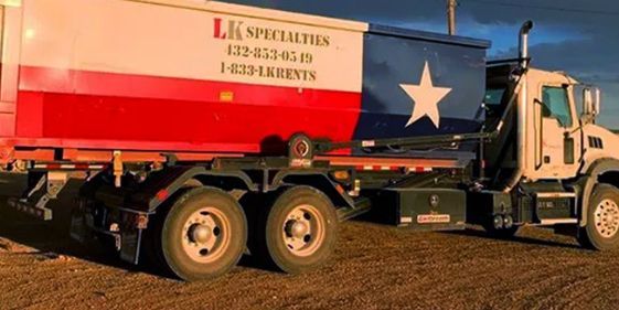 A white, red, and blue dumpster truck with the Texas state flag design.