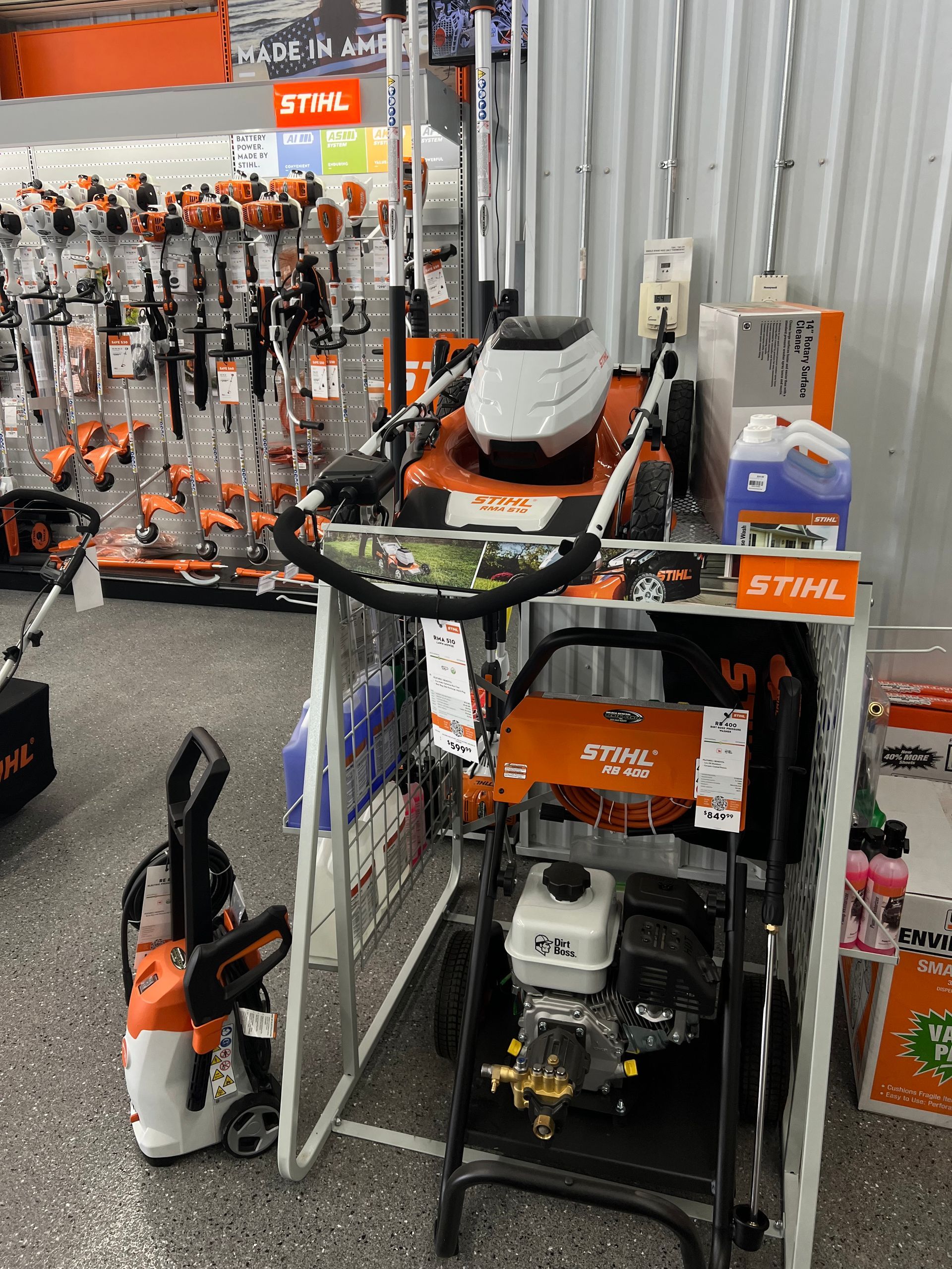 A stihl snow blower is on display in a store.