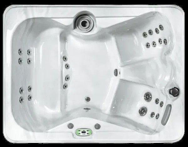 White rectangular hot tub with multiple jets and built-in seating, viewed from above