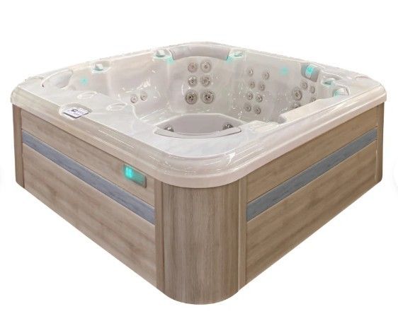 Square wood-grain hot tub with beige interior and blue-lit controls, shown against a white background