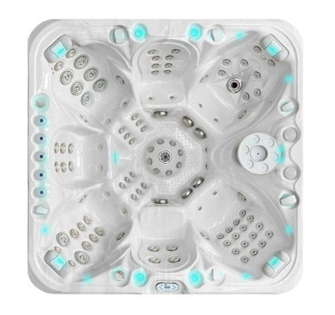 White square hot tub with multiple gray seats and aqua-lit jets, seen from above