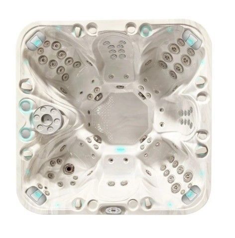 White square hot tub spa with multiple seats and jets, viewed from above.