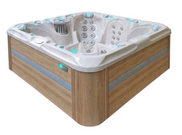Wood-paneled outdoor hot tub with white interior and built-in jet seats