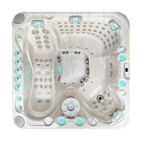 White square hot tub with multiple built-in seats, jets, and glowing blue lights