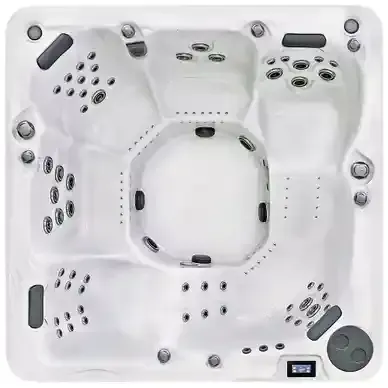 White hot tub spa with multiple jets, gray headrests, and a built-in control panel.