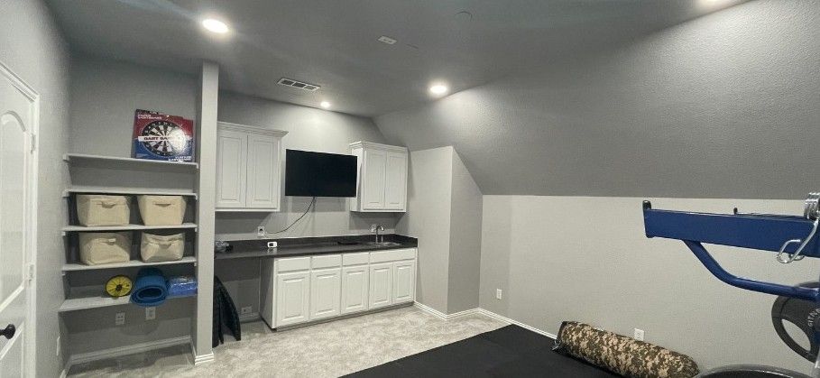 painted room with cabinets