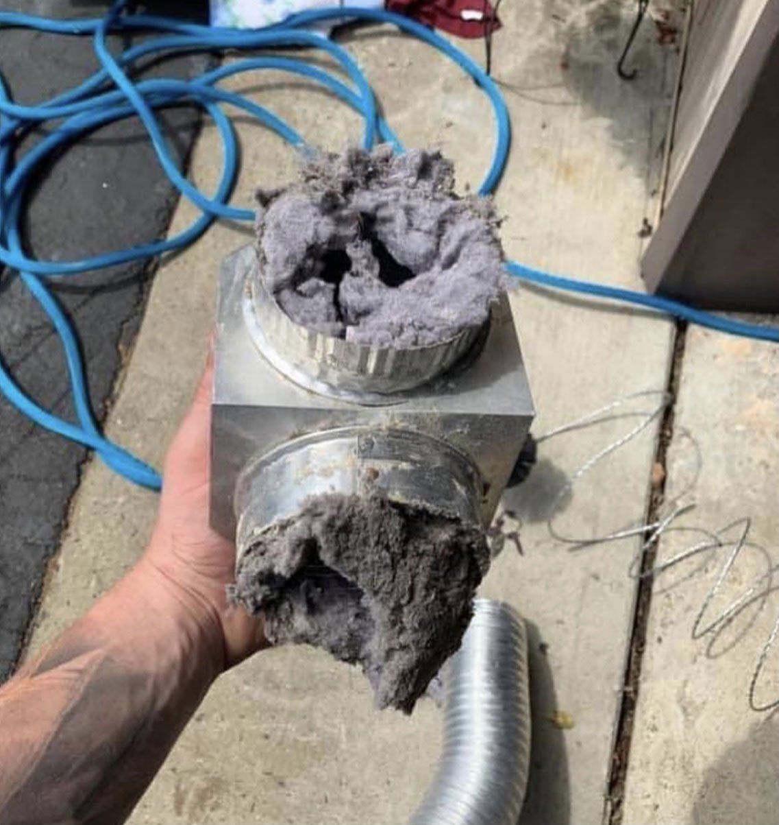 A dryer vent full of dirt