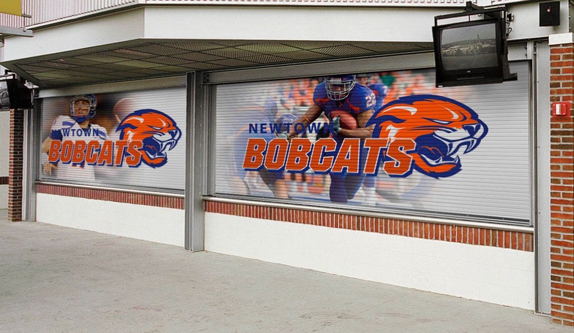 A bobcats sign is on the side of a building