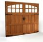 A wooden garage door with windows on a white background.
