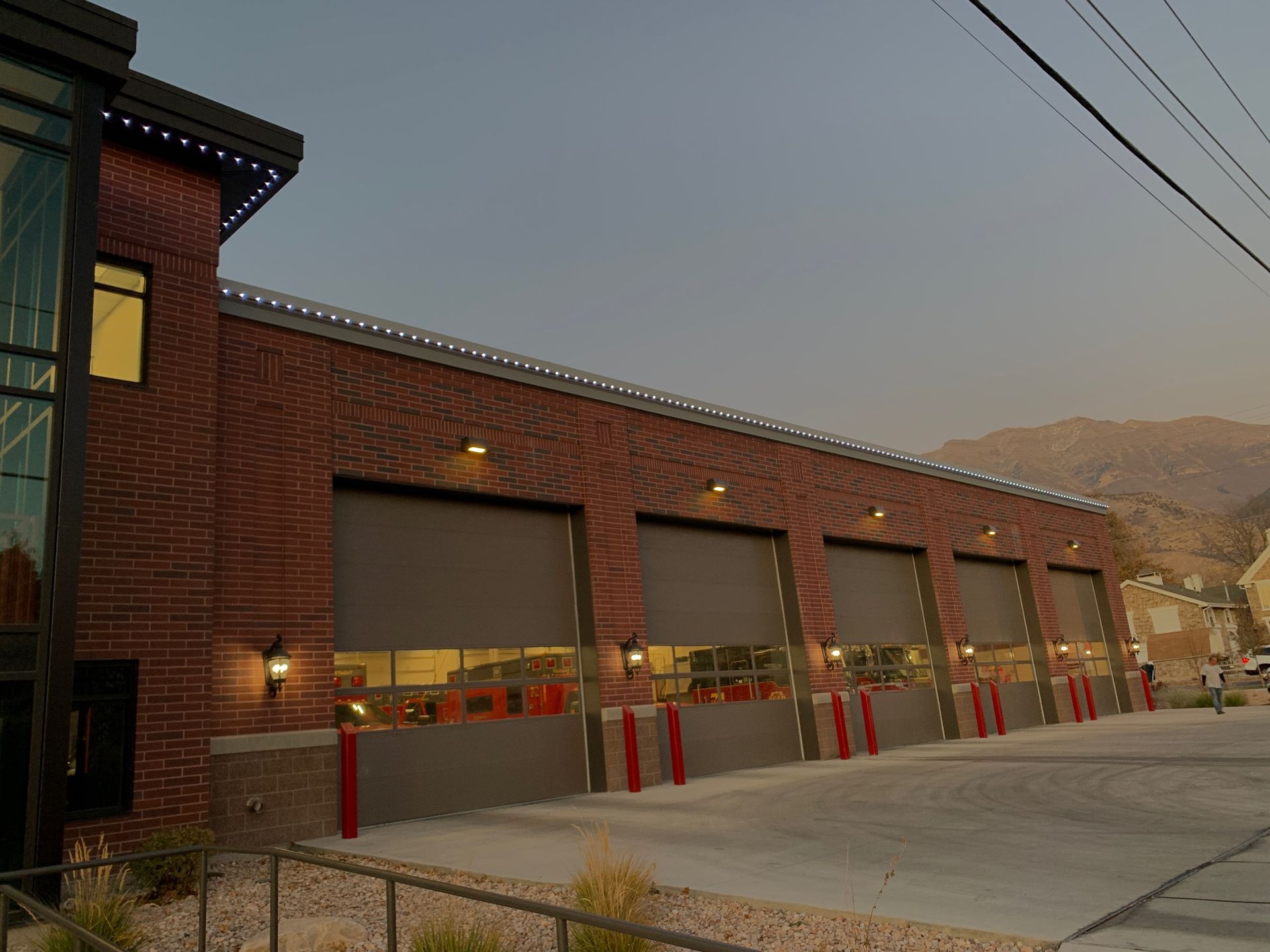 A brick building with a lot of garage doors