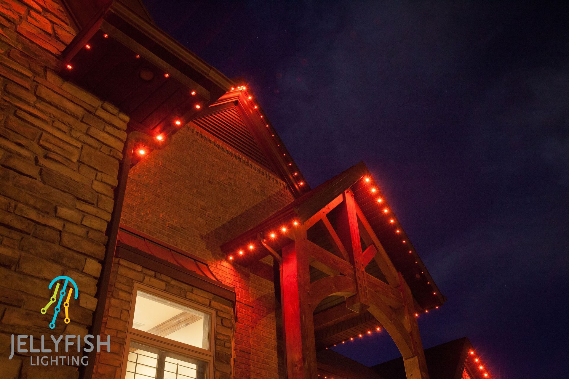 A jellyfish lighting logo is on the side of a building