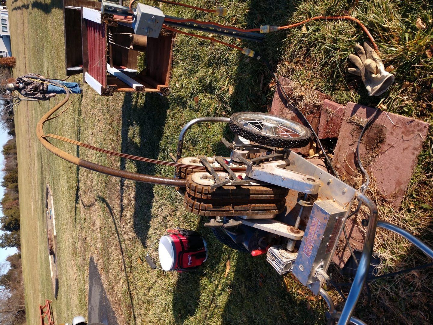 An aerial view of a tractor in a grassy field