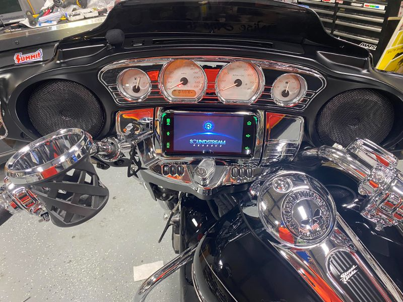 A motorcycle with a radio and speakers on it