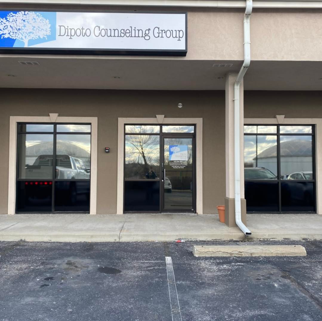 A building with a sign that says dipoto counseling group