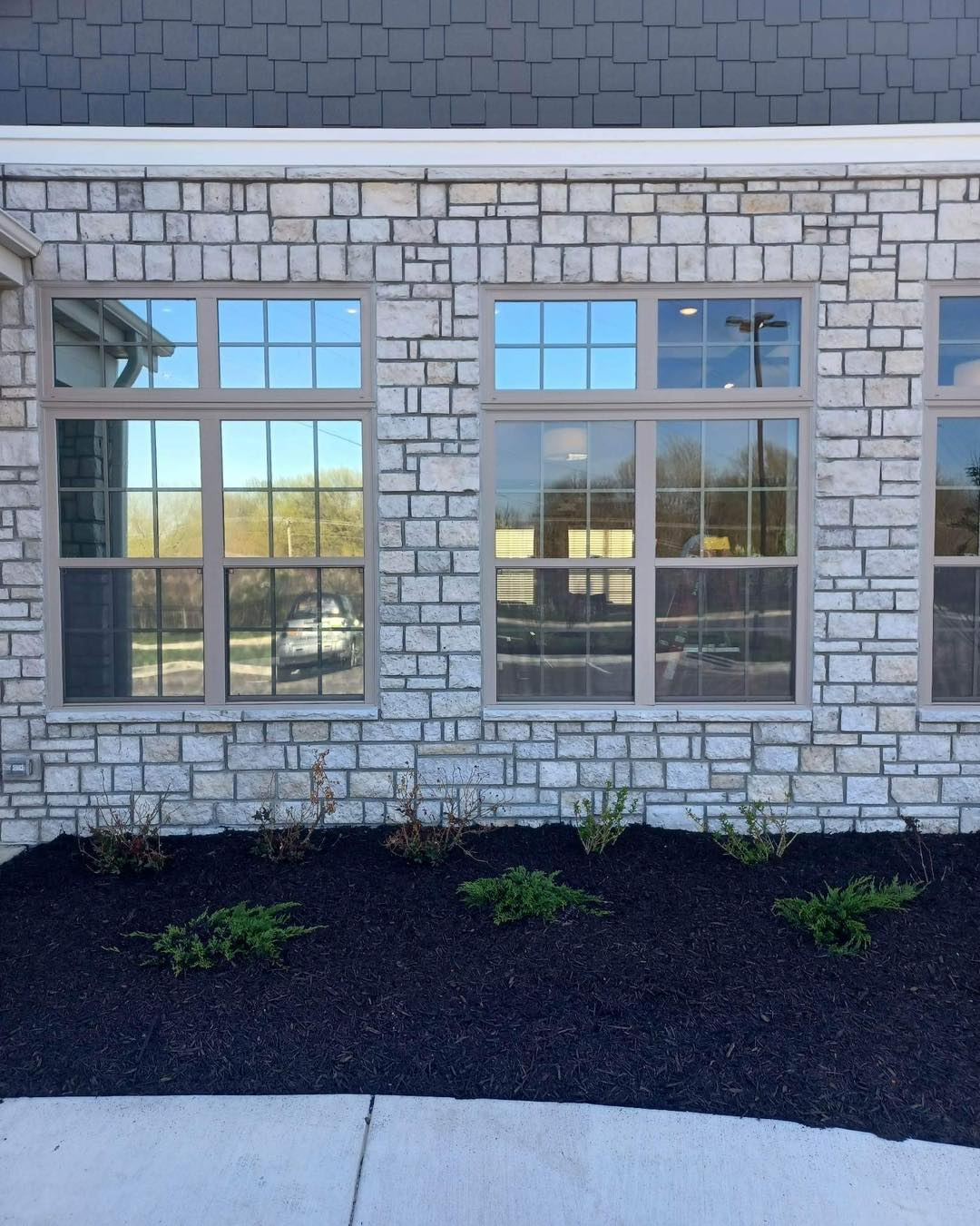 A brick building with a lot of windows on it