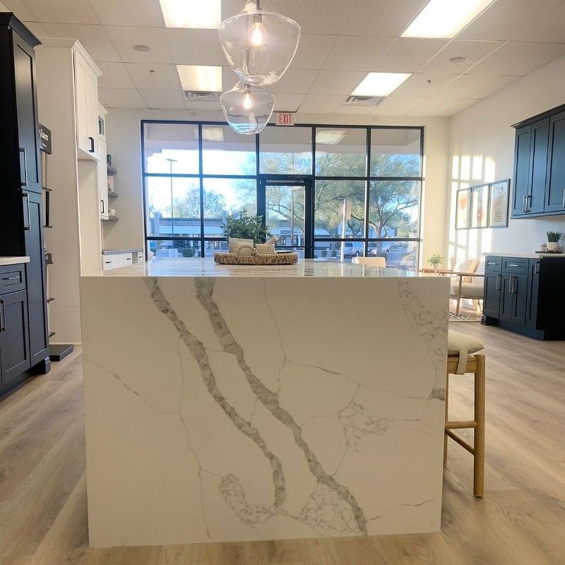A kitchen with a large island in the middle of the room.