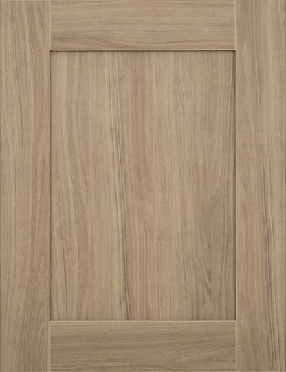 A close up of a wooden door with a square frame.