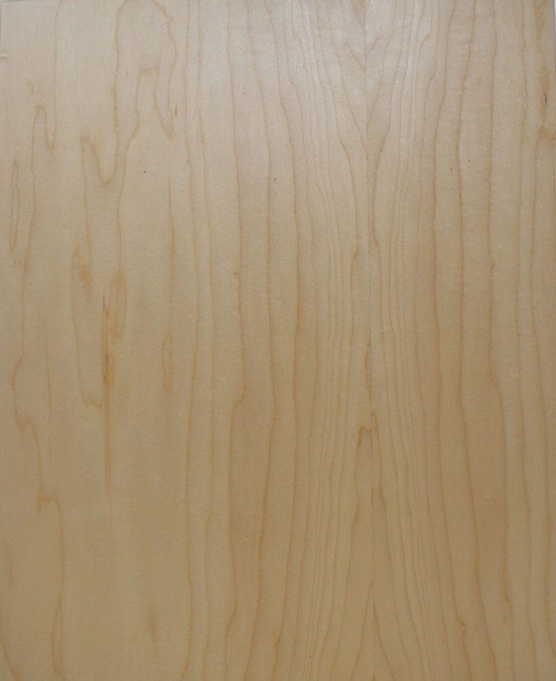 A close up of a piece of wood with a grain pattern.
