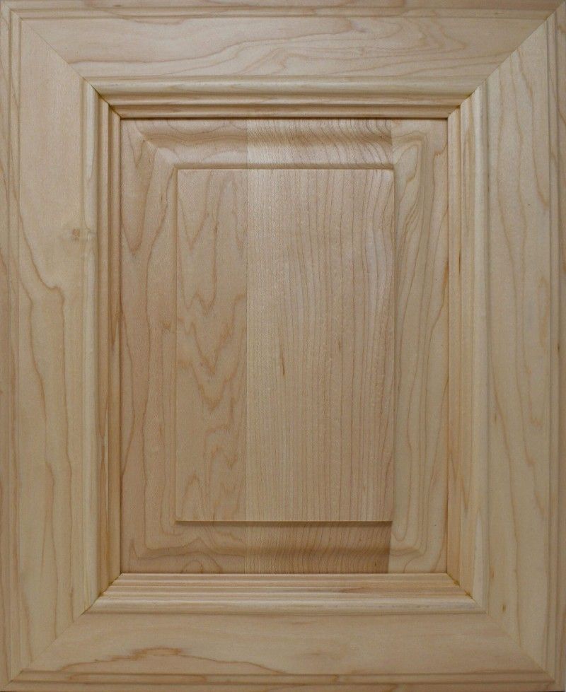A close up of a wooden door with a square frame