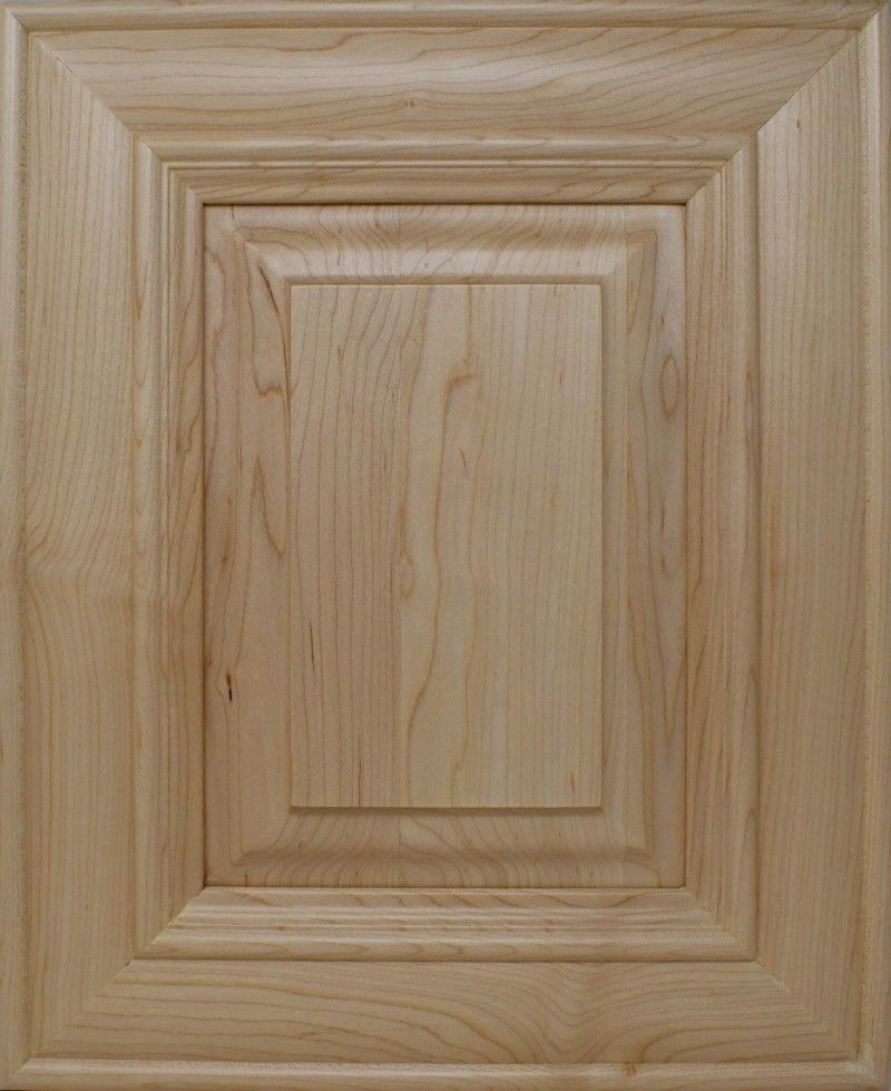A close up of a wooden door with a square frame