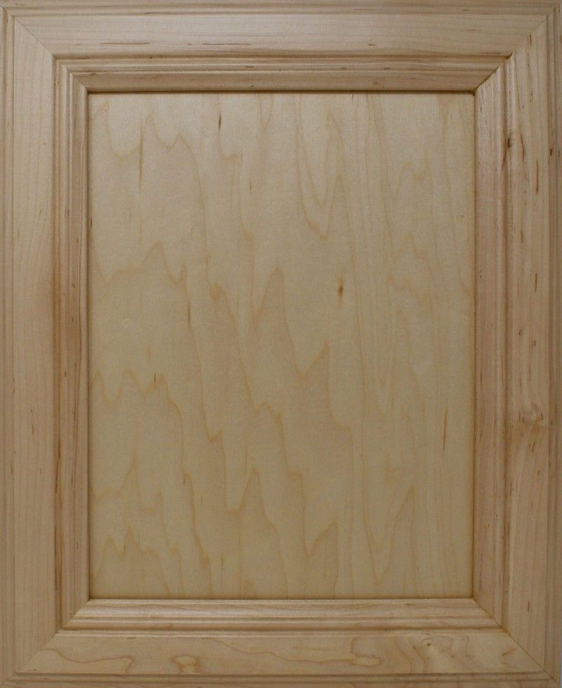 A close up of a wooden cabinet door with a wooden frame.