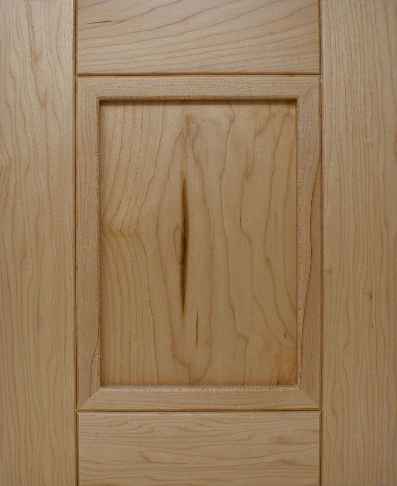 A close up of a wooden door with a square frame