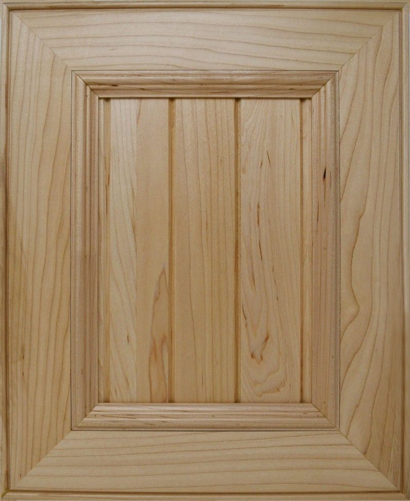 A close up of a wooden door with a wooden frame