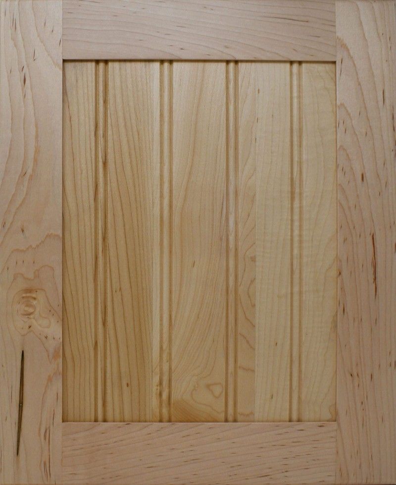 A close up of a wooden cabinet door