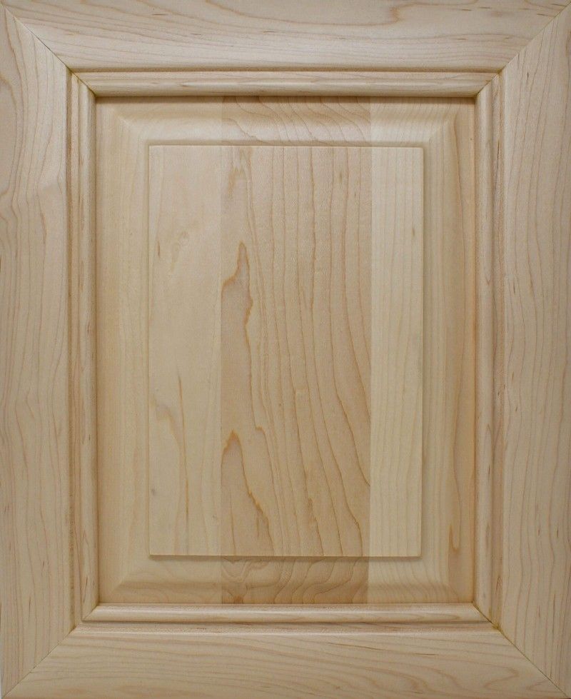 A close up of a wooden cabinet door with a square frame.