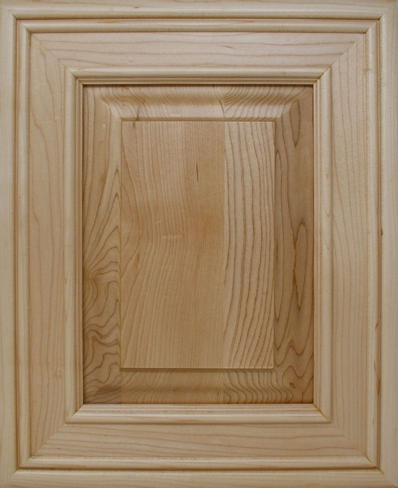 A close up of a wooden cabinet door on a white background.